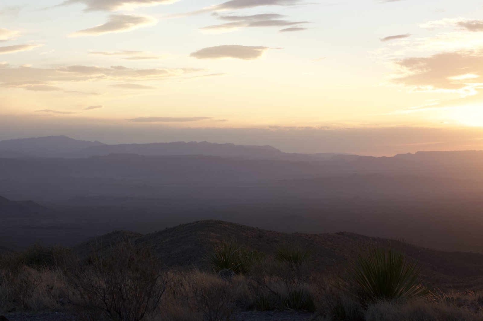 Desert Sunset Over Layered Mountains