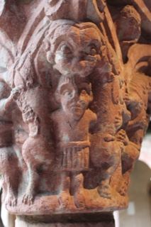 Carved stone capital grotesque figures