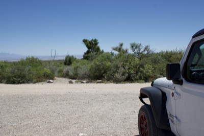 White Jeep at Desert Gravel Lot