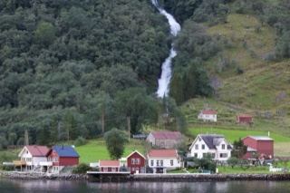 Norwegian Fjord Village With Waterfall