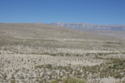 Arid Desert Plain with Distant Mountains