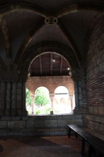 Interior arched cloister with bench