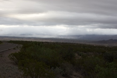Desert Road Under Storm Clouds