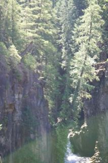 Sunlit Gorge With Reflecting River