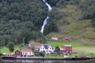 Norwegian Fjord Village With Waterfall