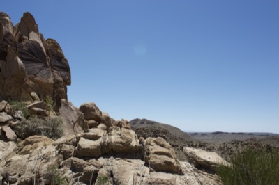 Arid Rocky Desert Landscape Under Clear Sky