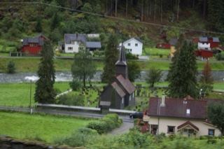 Rural Village Church By River Valley