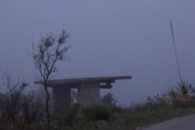 Foggy Shelter in Misty Landscape