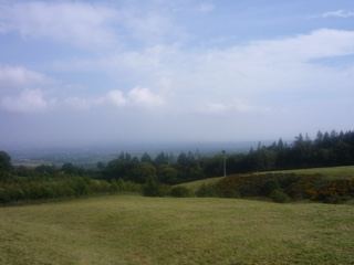 Grassy Hill Overlooking Distant Valley