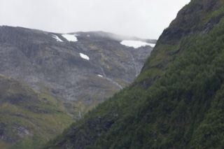 Mountain Valley With Snow Patches