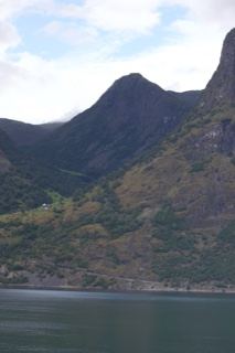 Mountainous Fjord With Cloudy Sky