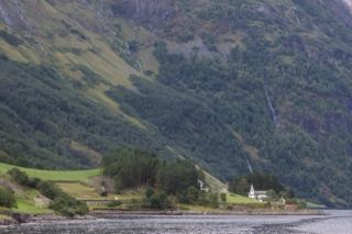 Fjord Valley Church Under Mountains