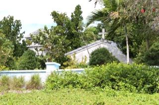 White chapel amid tropical foliage