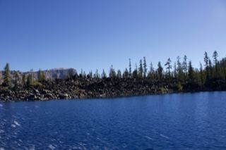 Alpine Lake With Rocky Shore