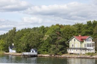 Lakeside Cottage on Tree-Lined Shore