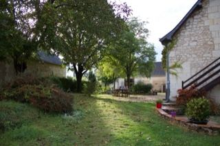 Sunlit Garden Yard Beside Stone House
