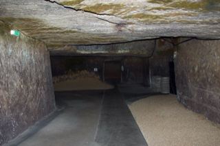 Underground stone tunnel with sand floor