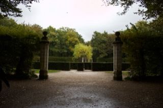 Formal Garden Avenue With Stone Pillars