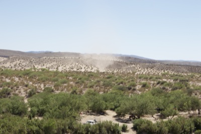 Desert Dust Devil Over Arid Landscape