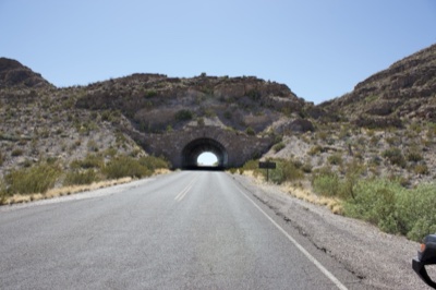 Desert Highway Leading to Mountain Tunnel