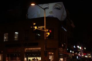 Projected Face on Building at Night