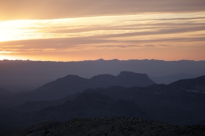 Sunset Over Layered Desert Mountains