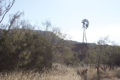 Windmill in Arid Rural Landscape