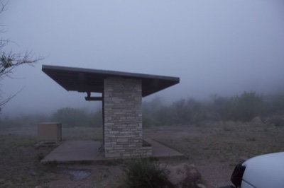 Stone Shelter in Foggy Landscape