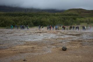 Tourists at Geysir geothermal field Iceland