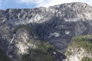 Rugged Mountain Cliff with Waterfall
