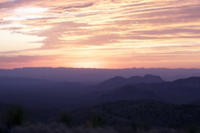 Desert Sunset Over Mountain Silhouettes