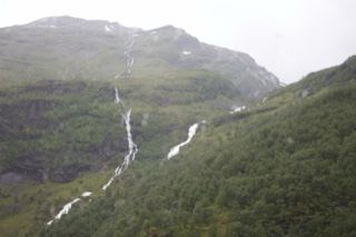 Mountain Waterfalls in Misty Green Valley