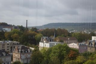 Overlook of city with trees and hills