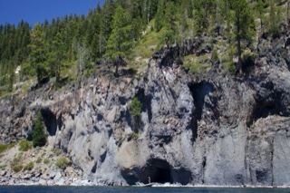 Rugged Cliff Face with Forest Above
