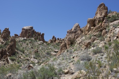 Desert Rocky Outcrops Under Clear Sky