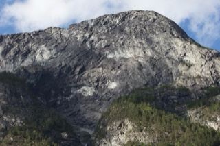 Rugged Mountain Peak Under Cloudy Sky