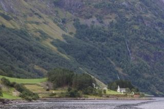 Fjord Valley with Church Below Mountains