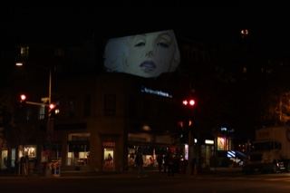 Projected Face on Building at Night