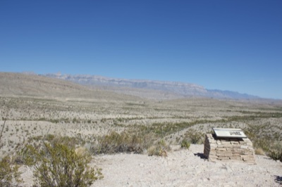 Desert landscape with stone marker