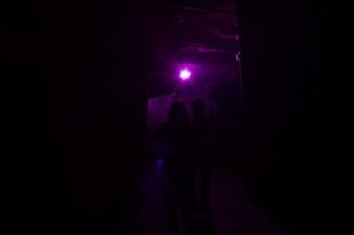 Purple Lit Dark Corridor Silhouettes