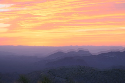 Sunset Over Layered Desert Mountains