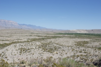 Arid Desert Valley with Distant Mountains
