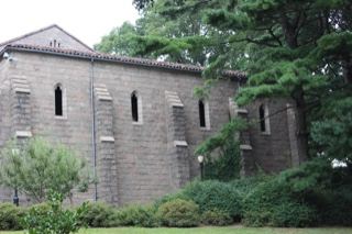 Stone chapel surrounded by trees