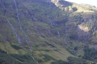 Mountain Valley Waterfalls Cascading Down Slope