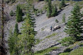 Hiker on Rocky Mountain Slope