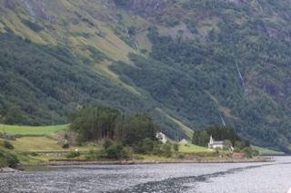 Fjord Valley with Houses Under Mountains