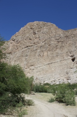 Desert Cliff and Trail Under Clear Sky