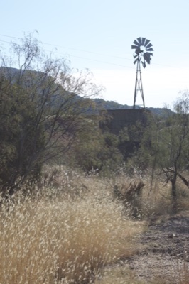 Windmill in Arid Desert Landscape