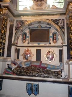 Ornate tomb effigy in church interior