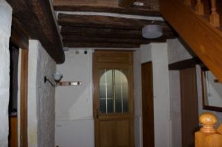 Interior hallway with wooden beams and stairs